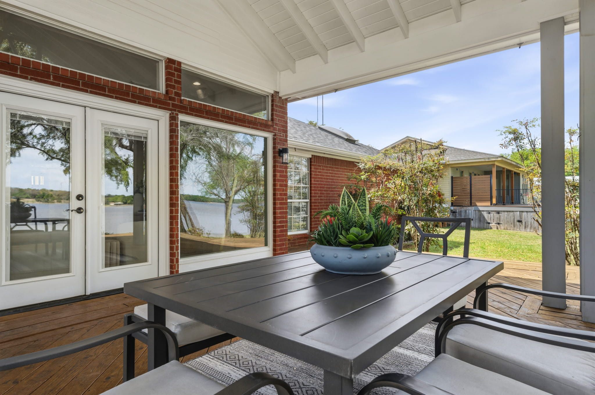 Covered back porch — lakeside outdoor staging